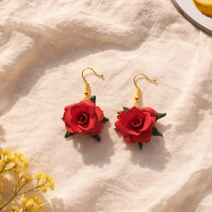 Enchanted Elegance red floral statement earrings, handmade botanical clay jewelry, romantic boho red rose dangles for special occasions.