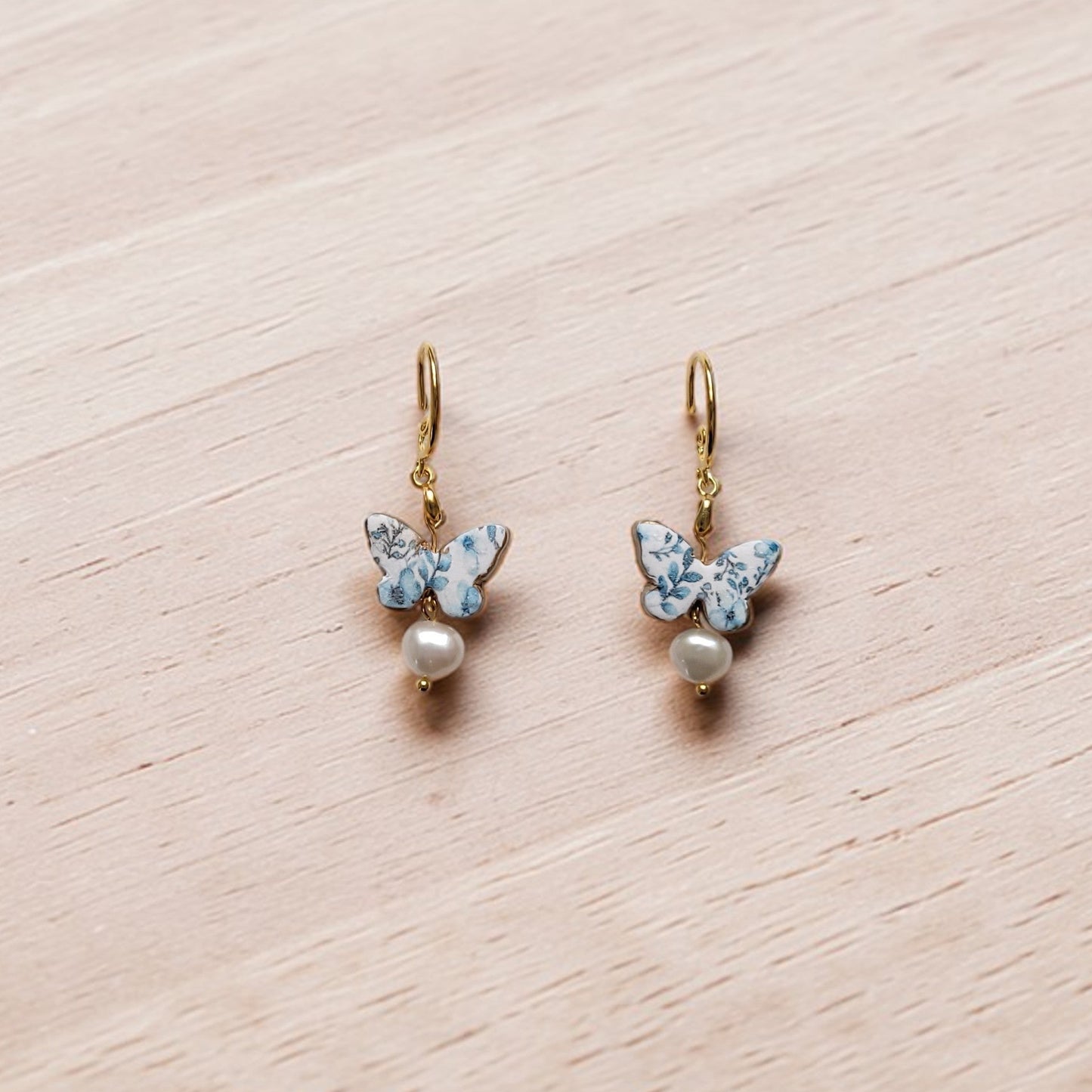 Enchanted Elegance blue chinoiserie butterfly dangles, coastal boho pearl earrings, patterned clay jewelry for summer vacations, butterfly gift for her.