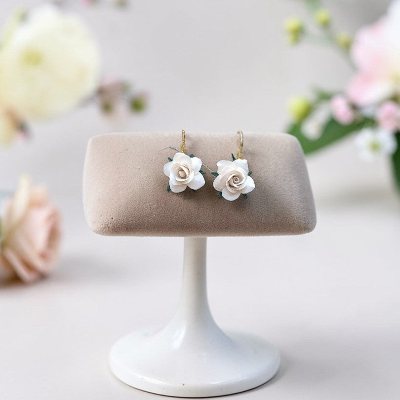 Enchanted Elegance white floral dangles, handmade bridal clay jewelry, minimalist boho rose earrings for weddings, neutral spring accessories.