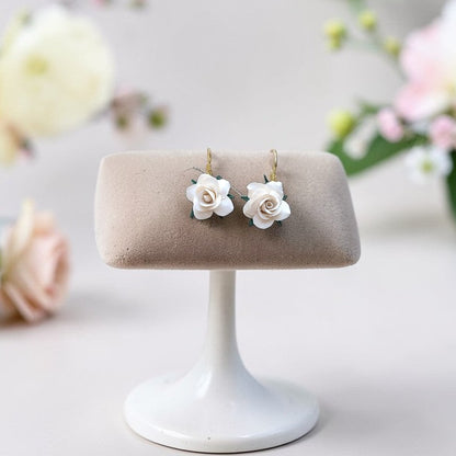 Enchanted Elegance white floral dangles, handmade bridal clay jewelry, minimalist boho rose earrings for weddings, neutral spring accessories.